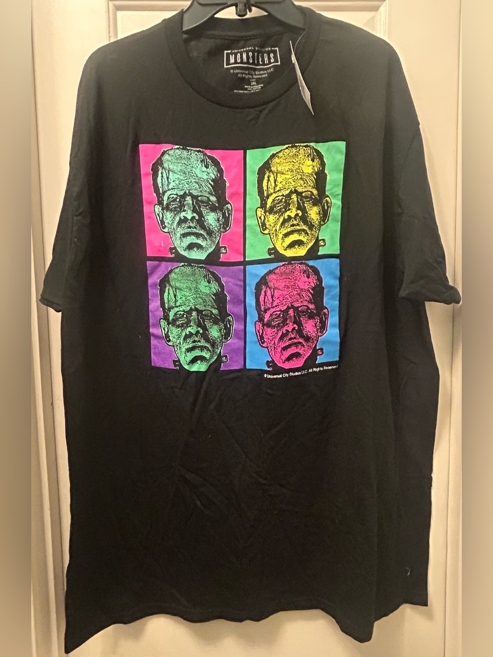 Frankenstein Graphic Tee with Neon Pop-Art Faces unisex